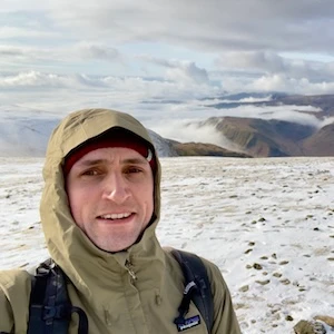 Mike Carter climbing a hill in the snow