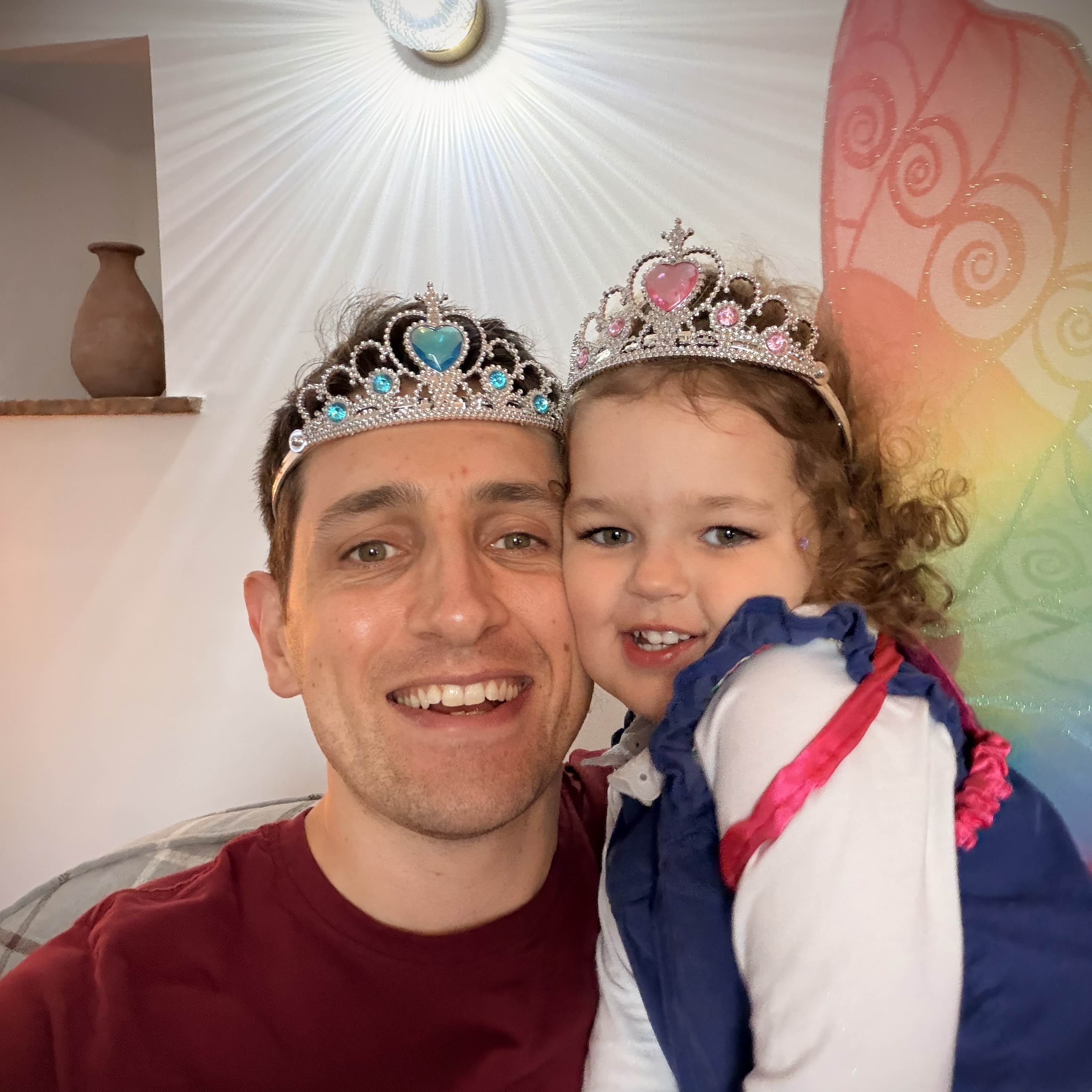 Mike Carter with daughter wearing tiaras